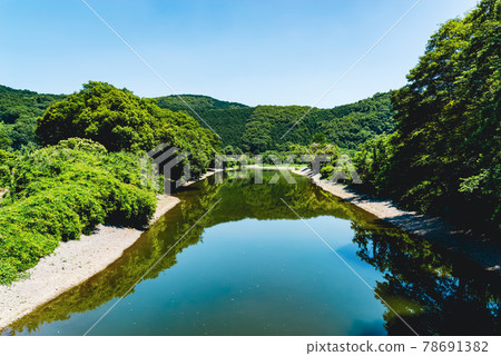 Summer satoyama river and lush green landscape Mountain green and blue sky reflected on the river surface a-2 Vivid Summer satoyama river and lush green landscape Mountain green and blue sky reflected on the river surface a-2 Vivid 78691382