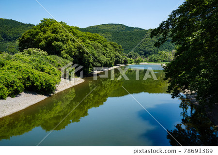 Summer satoyama river and lush green landscape Mountain green and blue sky reflected on the river surface c-1 78691389