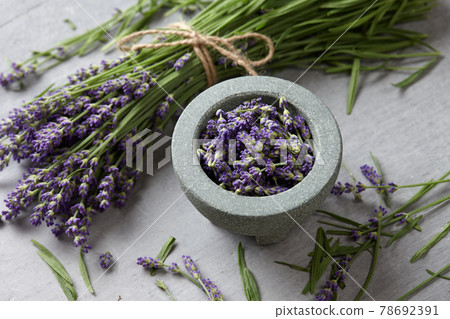 Lavender blossoms bowl on gray concrete background 78692391