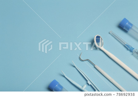 Medical instruments, devices and items on the colored table in the hospital. Syringe, test tube, tweezers. Healthcare, medicine, treatment and doctors concept 78692938