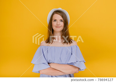 Beautiful woman in straw hat wear stylish summer dress with bare shoulders , smiling having good mood with arms folded looking at camera People, season, summer style concept People, season, summer 78694127