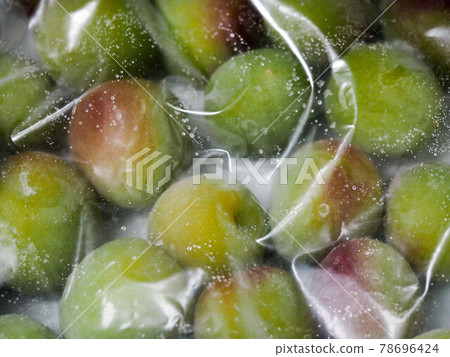 Frozen plums, plum work June 78696424