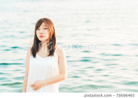 One-piece woman entering the sea One-piece woman entering the sea 78696465