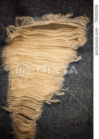 Torn denim vintage background. Torn denim vintage background. 78698306