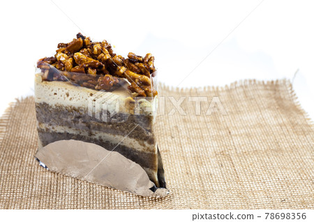 Almond toffee cake with coffee flavored icing. 78698356