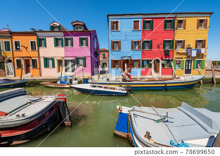Multi Colored Houses and Canal with Boats in Burano Island - Venice Italy 78699650