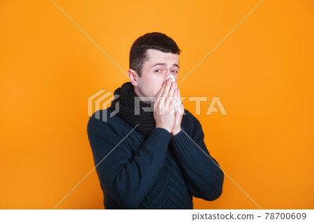 Man cover his sneeze with handkerchief. Flu. influenza, runny nose, sneeze Man cover his sneeze with handkerchief. Flu. influenza, runny nose, sneeze 78700609