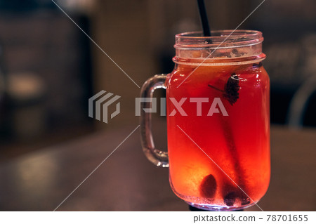 Christmas drink mulled wine with a straw on the background of the cafe interior 78701655
