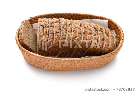 sliced rye bread in a wicker basket, isolated on a white background 78702937