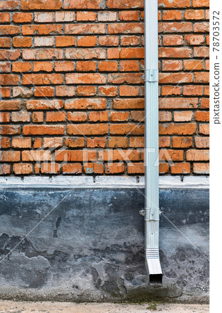old red brown brick wall and drain pipe for background or texture 78703572