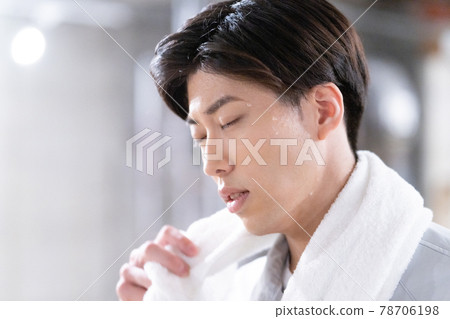 Young workers sweating at the construction site Young workers sweating at the construction site 78706198