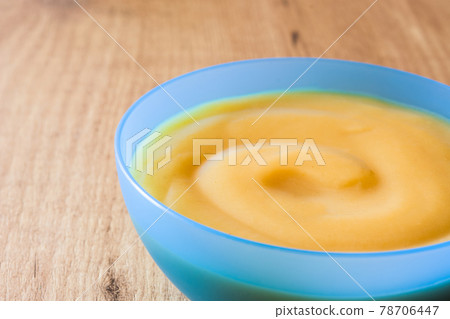 Baby food: colorful bowl of fruit puree 78706447