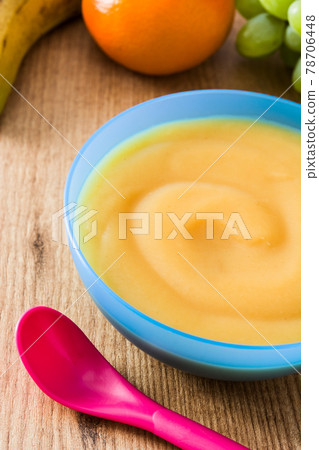 Baby food: colorful bowl of fruit puree 78706448
