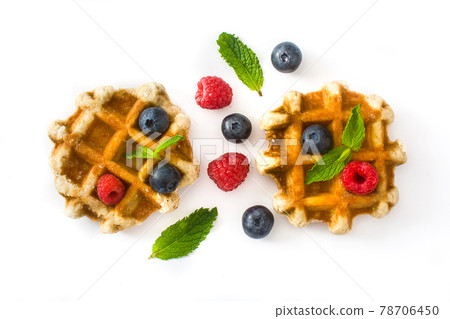 Traditional belgian waffles with blueberries and raspberries 78706450