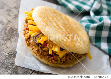 Arepa with shredded beef and cheese Arepa with shredded beef and cheese 78706474