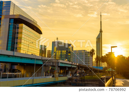 Bright dusk sun and backlit Fukuoka Tower and urban expressway golden emphasis 78706992