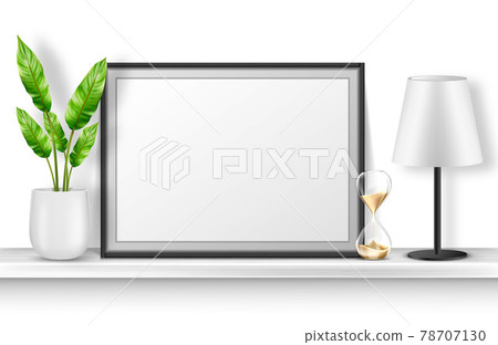 Empty photo frame stand on white shelf with plant 78707130