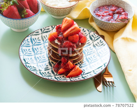 Vegan gluten free banana buckwheat pancakes served with dairy free yogurt and chia strawberry jam 78707522