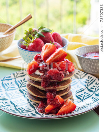 Vegan gluten free banana buckwheat pancakes served with dairy free yogurt and chia strawberry jam 78707528