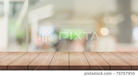 Empty wooden table top with lights bokeh on blur restaurant background Empty wooden table top with lights bokeh on blur restaurant background 78707950