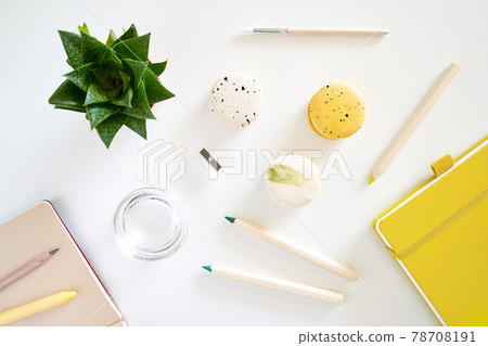Flat lay art tools with macaroons, coffee, succulent, notepad on white Flat lay art tools with macaroons, coffee, succulent, notepad on white 78708191