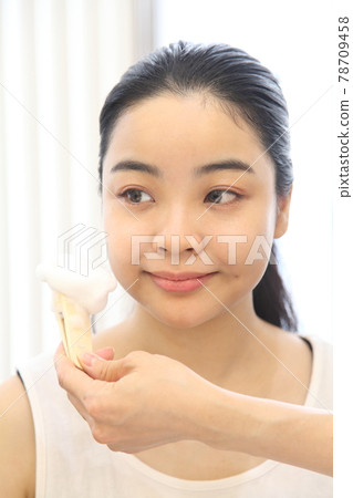 Female hands with bubbles and young female face Female hands with bubbles and young female face 78709458