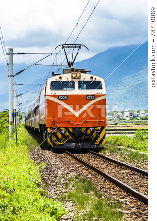 Chu-Kuang Express train through the beautiful countryside of Taitung, Taiwan 78710089