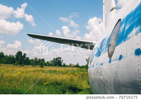 The tail of an aircraft that has collapsed from time to time or from an accident. Metal parts of the frame, parts of the fuselage, skin and pieces of fabric are visible. Rust and scraps of old fabric The tail of an aircraft that has collapsed from time to time or from an accident. Metal parts of the frame, parts of the fuselage, skin and pieces of fabric are visible. Rust and scraps of old fabric 78710175