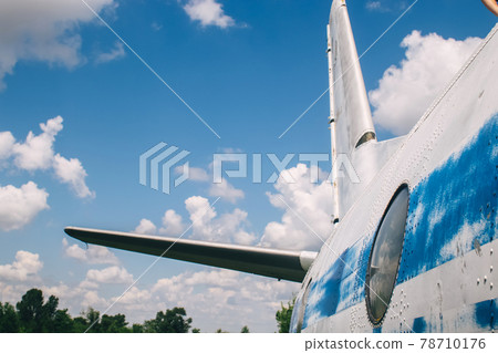 The tail of an aircraft that has collapsed from time to time or from an accident. Metal parts of the frame, parts of the fuselage, skin and pieces of fabric are visible. Rust and scraps of old fabric The tail of an aircraft that has collapsed from time to time or from an accident. Metal parts of the frame, parts of the fuselage, skin and pieces of fabric are visible. Rust and scraps of old fabric 78710176