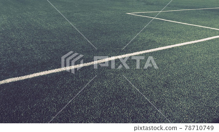 soccer field for championship.The marking of the football field on the green grass. White lines no more than 12 cm or 5 inches wide. Football field area soccer field for championship.The marking of the football field on the green grass. White lines no more than 12 cm or 5 inches wide. Football field area 78710749