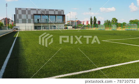 football field with markings. Football stadium. Sports background. Sports center in the city. 78710752