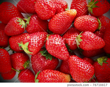 Strawberry. Strawberry background. Delicious ripe red large berries of garden strawberry. Healthy food, vitamins and a vegetarian diet. Still life with food. Copy space. Flat lay 78710817