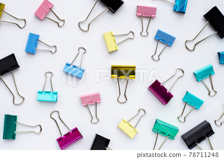 Colorful office paper clips on white background. 78711248