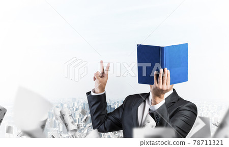 Businessman covered his face with organizer Businessman covered his face with organizer 78711321