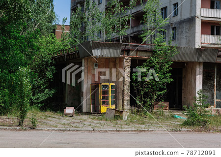 Phone box near abandoned building in centre of ghost town Pripyat Chornobyl Zone Phone box near abandoned building in centre of ghost town Pripyat Chornobyl Zone 78712091