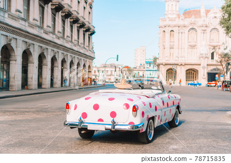 View of yellow classic vintage car in Old Havana, Cuba 78715835