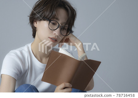 A woman reading a book A woman reading a book 78716458