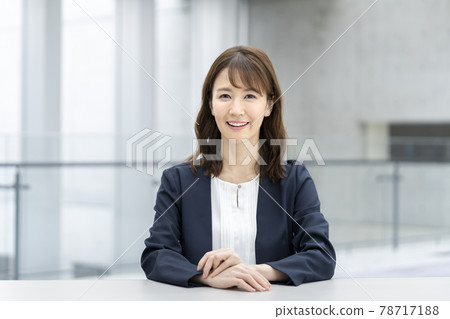 Smiling businesswoman looking at camera 78717188