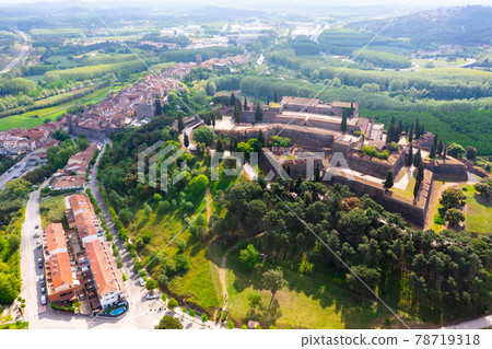 Aerial view of medieval Castle on hilltop in Spanish village of Hostalric 78719318
