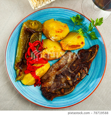 Popular dish of grilled beef Churrasco, potatoes and peppers 78719588