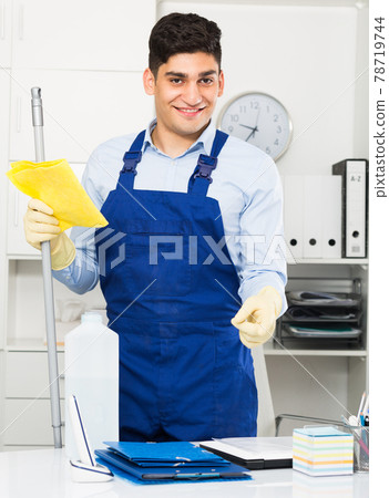 House worker is ready to clean the cabinet House worker is ready to clean the cabinet 78719744