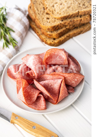 Sliced smoked salami. Sliced smoked salami. 78720321