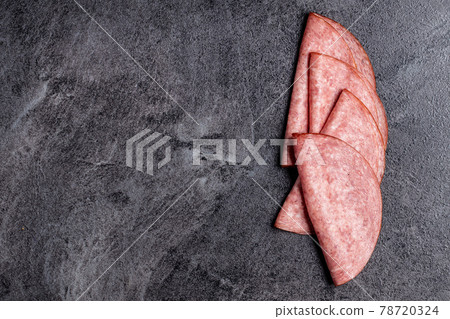 Sliced smoked salami. 78720324