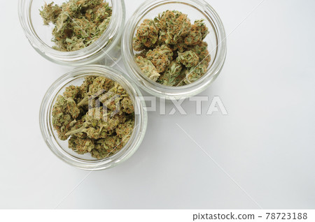 Marijuana buds storage. Medicinal cannabis flowering on white background, isolated, top view. 78723188
