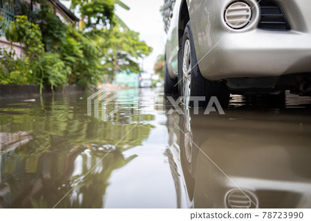Flooded car vehicles after heavy rain,full of waste water on the road,street in the alley were covered with a large amount of water,drainage problems 78723990