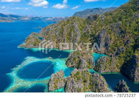 Aerial view of turquoise tropical lagoon with limestone cliffs in Coron Island, Palawan, Philippines 78725237