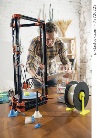 New generation of 3D Printing Machine printing a piece of plastic. For use in small spaces, Office or Private use 78726225