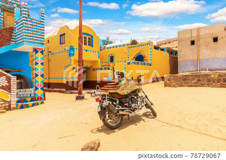Traditional Nubian village in Africa and an authentic motorbike, Egypt 78729067