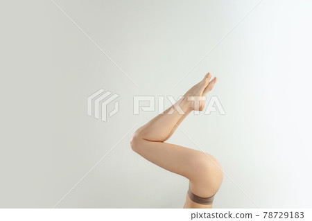 Beautiful female legs isolated on white background. Beauty, cosmetics, spa, depilation, treatment and fitness concept. Fit and sportive, sensual body with well-kept skin in underwear. Beautiful female legs isolated on white background. Beauty, cosmetics, spa, depilation, treatment and fitness concept. Fit and sportive, sensual body with well-kept skin in underwear. 78729183