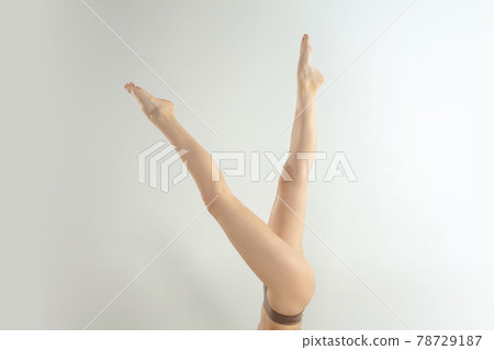 Beautiful female legs isolated on white background. Beauty, cosmetics, spa, depilation, treatment and fitness concept. Fit and sportive, sensual body with well-kept skin in underwear. Beautiful female legs isolated on white background. Beauty, cosmetics, spa, depilation, treatment and fitness concept. Fit and sportive, sensual body with well-kept skin in underwear. 78729187